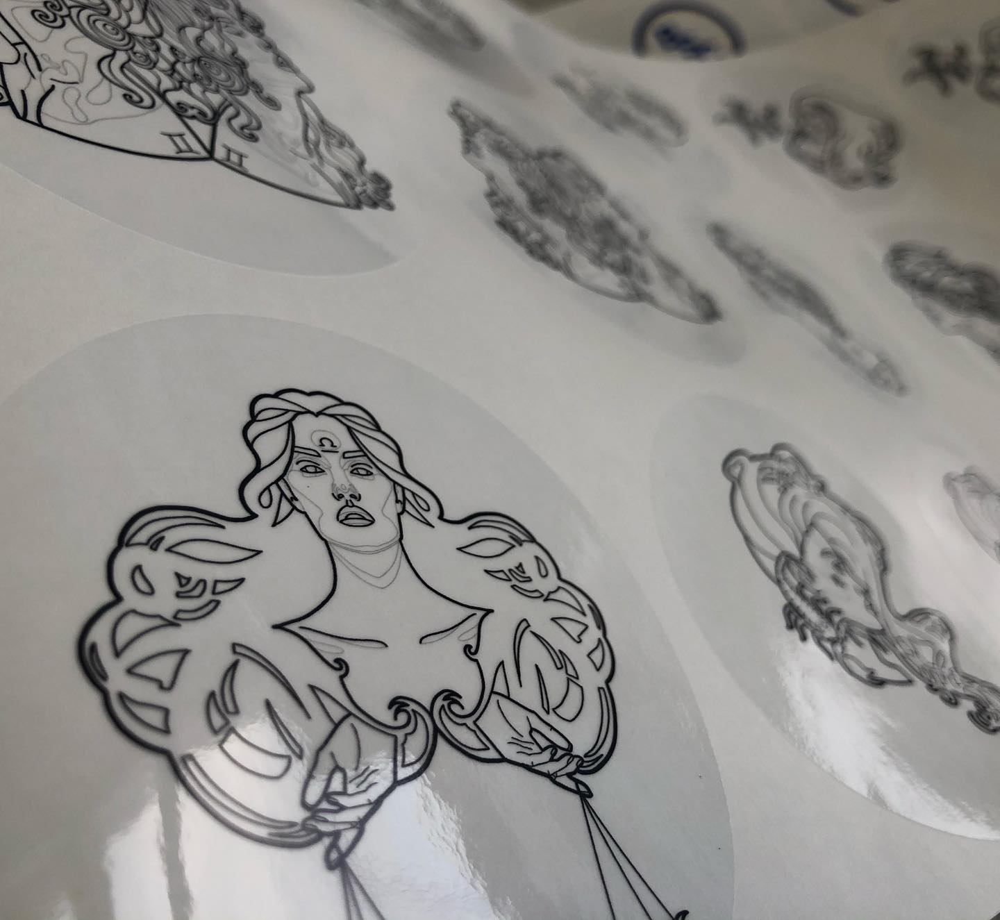 Custom clear glossy vinyl sticker with monochromatic lady portrait – transparent branded label