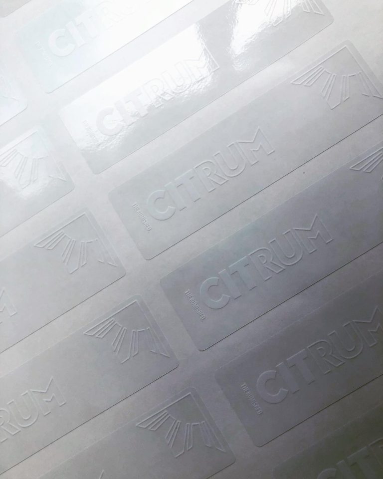 Custom clear glossy vinyl labels with white ink only print on backing sheet – transparent branded stickers