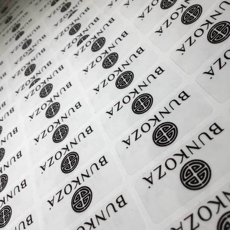 Custom clear vinyl sticker with monochromatic logo print – branded transparent label