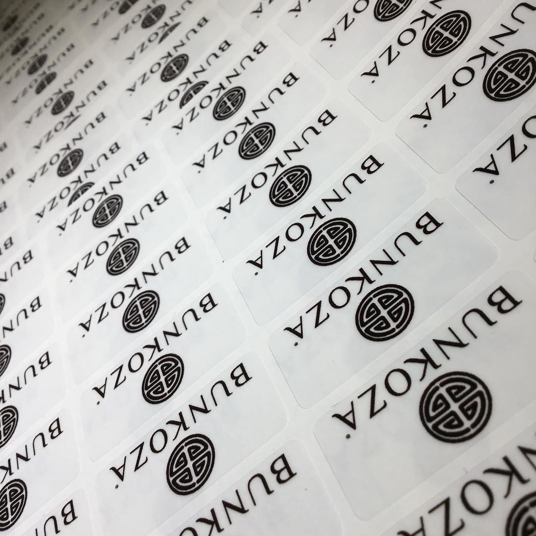 Custom clear vinyl sticker with monochromatic logo print – branded transparent label