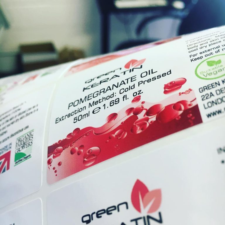 Custom glossy vinyl pomegranate oil labels – branded waterproof stickers