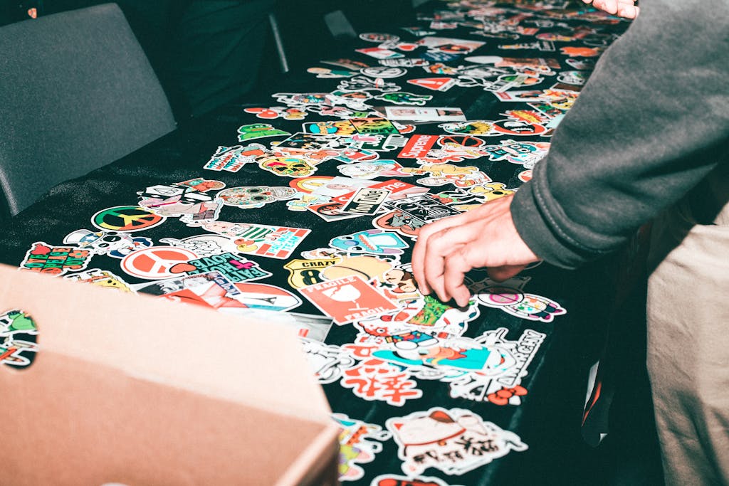 Vibrant assortment of stickers displayed on a table indoors.