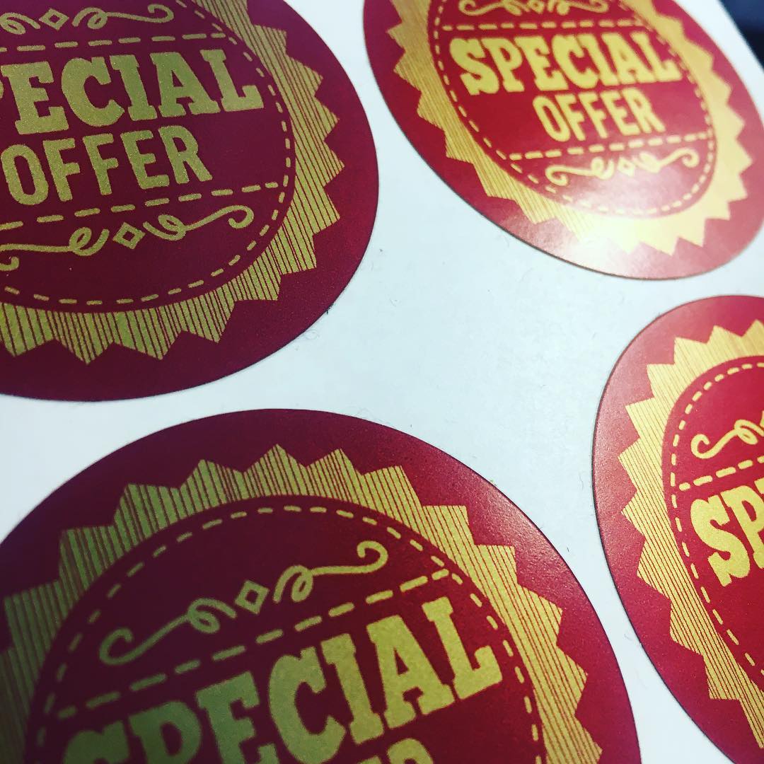 Example of custom round satin gold vinyl gin labels printed in monochromatic (single-colour) design with clear, premium branding on waterproof 70-micron material. Subtle metallic sheen with non-glare satin finish for upscale, sophisticated look. Ideal for spirits, craft gin, luxury beverages or premium packaging. Designed online at Sticker Nation UK.