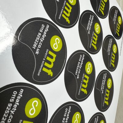 Custom shaped business stickers, created on the Sticker Nation designer. — Glossy Waterproof Stickers